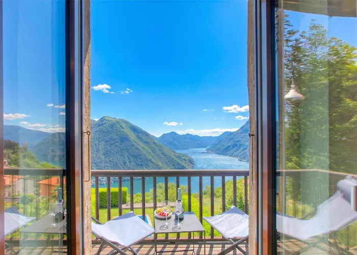 Angelina: Panoramic Lake View House On Monte Bre | Terrace & Balcony - Happy Rentals